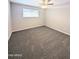 Spacious bedroom with ceiling fan and gray carpeting at 2044 W 9Th Ave, Apache Junction, AZ 85120