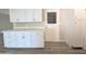 Modern kitchen island with white cabinets and quartz countertops at 2044 W 9Th Ave, Apache Junction, AZ 85120