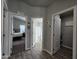 Bright hallway with doors leading to bedrooms and bathroom at 650 N Hawes Rd # 3314, Mesa, AZ 85207