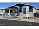 Home exterior showcasing a two-tone paint scheme and front porch at 650 N Hawes Rd # 3314, Mesa, AZ 85207