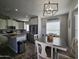 Modern kitchen with island, stainless steel appliances, and ample cabinet space at 650 N Hawes Rd # 3314, Mesa, AZ 85207