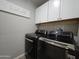Laundry room with washer, dryer, and storage cabinets at 650 N Hawes Rd # 3314, Mesa, AZ 85207