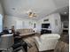 Spacious living room featuring a comfortable seating arrangement and wood-look flooring at 650 N Hawes Rd # 3314, Mesa, AZ 85207