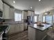 Modern kitchen with stainless steel appliances and island at 650 N Hawes Rd # 3314, Mesa, AZ 85207
