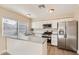 Modern kitchen with white cabinets and stainless steel appliances at 7201 W Catalina Dr, Phoenix, AZ 85033