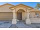 House exterior featuring a walkway to the front door and attached garage at 7201 W Catalina Dr, Phoenix, AZ 85033