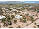 Aerial view of a house and surrounding desert landscape at 14428 E Monument Dr, Scottsdale, AZ 85262