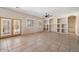 Bright living room with built-in shelving and tile floors at 14428 E Monument Dr, Scottsdale, AZ 85262