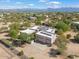Aerial view of a house with solar panels and a large backyard at 14428 E Monument Dr, Scottsdale, AZ 85262