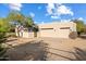Two-car garage with attached gate and desert landscaping at 14428 E Monument Dr, Scottsdale, AZ 85262