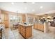 Open kitchen with large island, stainless steel appliances, and breakfast nook at 14428 E Monument Dr, Scottsdale, AZ 85262