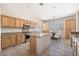 Eat-in kitchen with island, stainless steel appliances, and wood cabinets at 14428 E Monument Dr, Scottsdale, AZ 85262