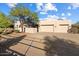 Aerial view of stucco home with double garage, mountain views at 14428 E Monument Dr, Scottsdale, AZ 85262