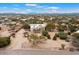 Aerial view of a house with a large yard and mountain backdrop at 14428 E Monument Dr, Scottsdale, AZ 85262