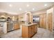 Open concept kitchen with large island, stainless steel appliances, and breakfast nook at 14428 E Monument Dr, Scottsdale, AZ 85262