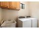 Laundry room with washer, dryer, and utility sink at 14428 E Monument Dr, Scottsdale, AZ 85262