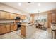 Large kitchen with an island, stainless steel appliances, and ample cabinet space at 14428 E Monument Dr, Scottsdale, AZ 85262