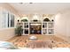 Built-in entertainment center with ample shelving and storage at 14428 E Monument Dr, Scottsdale, AZ 85262