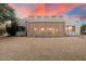 Beautiful stucco home with a screened-in patio and spiral staircase at 14428 E Monument Dr, Scottsdale, AZ 85262