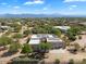 Aerial view of a house with solar panels and a large backyard at 14428 E Monument Dr, Scottsdale, AZ 85262