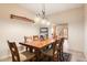 Bright dining room featuring a wood table and six chairs at 14428 E Monument Dr, Scottsdale, AZ 85262