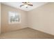 Bright bedroom with carpeted floor and window with shutters at 14428 E Monument Dr, Scottsdale, AZ 85262