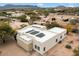 Aerial view of house showcasing solar panels and surrounding landscape at 14428 E Monument Dr, Scottsdale, AZ 85262