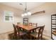 Bright dining room featuring a wood table and six chairs at 14428 E Monument Dr, Scottsdale, AZ 85262