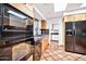 Modern kitchen with stainless steel appliances and tile flooring at 9252 E Whitethorn Cir, Scottsdale, AZ 85266