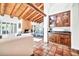 Built-in wet bar with wood cabinets and granite countertop at 9252 E Whitethorn Cir, Scottsdale, AZ 85266