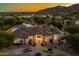 Luxury house exterior with mountain view at night at 6515 E Stallion Rd, Paradise Valley, AZ 85253