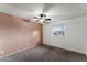 Bedroom with ceiling fan and textured wall at 8420 E Hubbell St, Scottsdale, AZ 85257