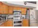 Kitchen features stainless steel appliances and granite countertops at 22814 N 32Nd Ave, Phoenix, AZ 85027