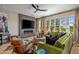 Spacious living room with fireplace, large windows, and comfortable seating at 37200 N Cave Creek Rd # 1126, Scottsdale, AZ 85262