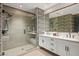 Elegant bathroom with a double vanity and geometric patterned wallpaper at 37200 N Cave Creek Rd # 1126, Scottsdale, AZ 85262