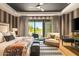 Spacious bedroom with golf course view, featuring a king-size bed and sitting area at 37200 N Cave Creek Rd # 1126, Scottsdale, AZ 85262