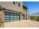 Two-car garage with glass doors and stone accents at 37200 N Cave Creek Rd # 1126, Scottsdale, AZ 85262