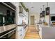 Modern kitchen with white cabinetry, marble countertops, and Wolf appliances at 37200 N Cave Creek Rd # 1126, Scottsdale, AZ 85262