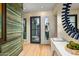 Light-filled entryway with modern finishes and a statement mirror at 37200 N Cave Creek Rd # 1126, Scottsdale, AZ 85262