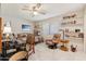 Bedroom with double bed, desk, and built in shelving at 10317 W Prairie Hills Cir, Sun City, AZ 85351