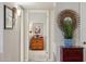 View down hallway, with bedroom door and decor at 10317 W Prairie Hills Cir, Sun City, AZ 85351