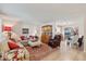Open concept living and dining area with hardwood floors at 10317 W Prairie Hills Cir, Sun City, AZ 85351