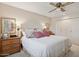 Spacious main bedroom with king bed and plenty of natural light at 10317 W Prairie Hills Cir, Sun City, AZ 85351