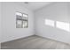 Bright bedroom with gray carpet and large window at 7366 E White Tail Rd, San Tan Valley, AZ 85143