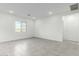 Spacious living room with tile floors and large window at 7366 E White Tail Rd, San Tan Valley, AZ 85143