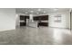 Open concept kitchen with island and dark cabinets at 7366 E White Tail Rd, San Tan Valley, AZ 85143
