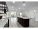 Open concept kitchen with island and backyard access at 7366 E White Tail Rd, San Tan Valley, AZ 85143