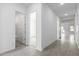 Bright hallway with doors to a bathroom and bedroom, tiled floor at 7366 E White Tail Rd, San Tan Valley, AZ 85143