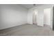 Bright bedroom with grey carpet and en-suite bathroom at 7366 E White Tail Rd, San Tan Valley, AZ 85143