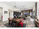 Farmhouse dining area with a wood table, metal chairs, and a chandelier at 20428 W Elm Dr, Buckeye, AZ 85396